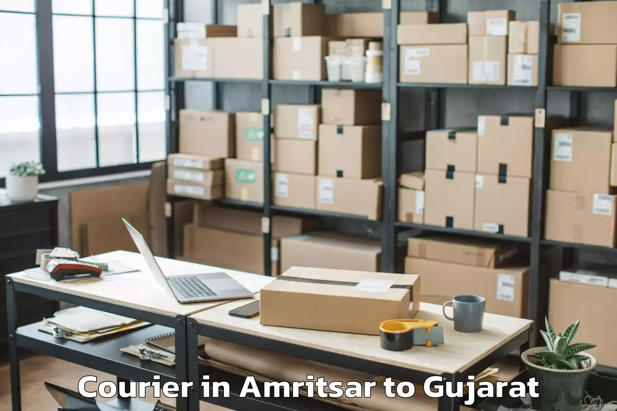 Book Amritsar to Crystal Mall Rajkot Courier Online